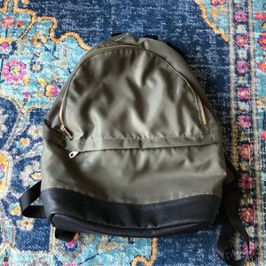 Olive green and faux leather backpack